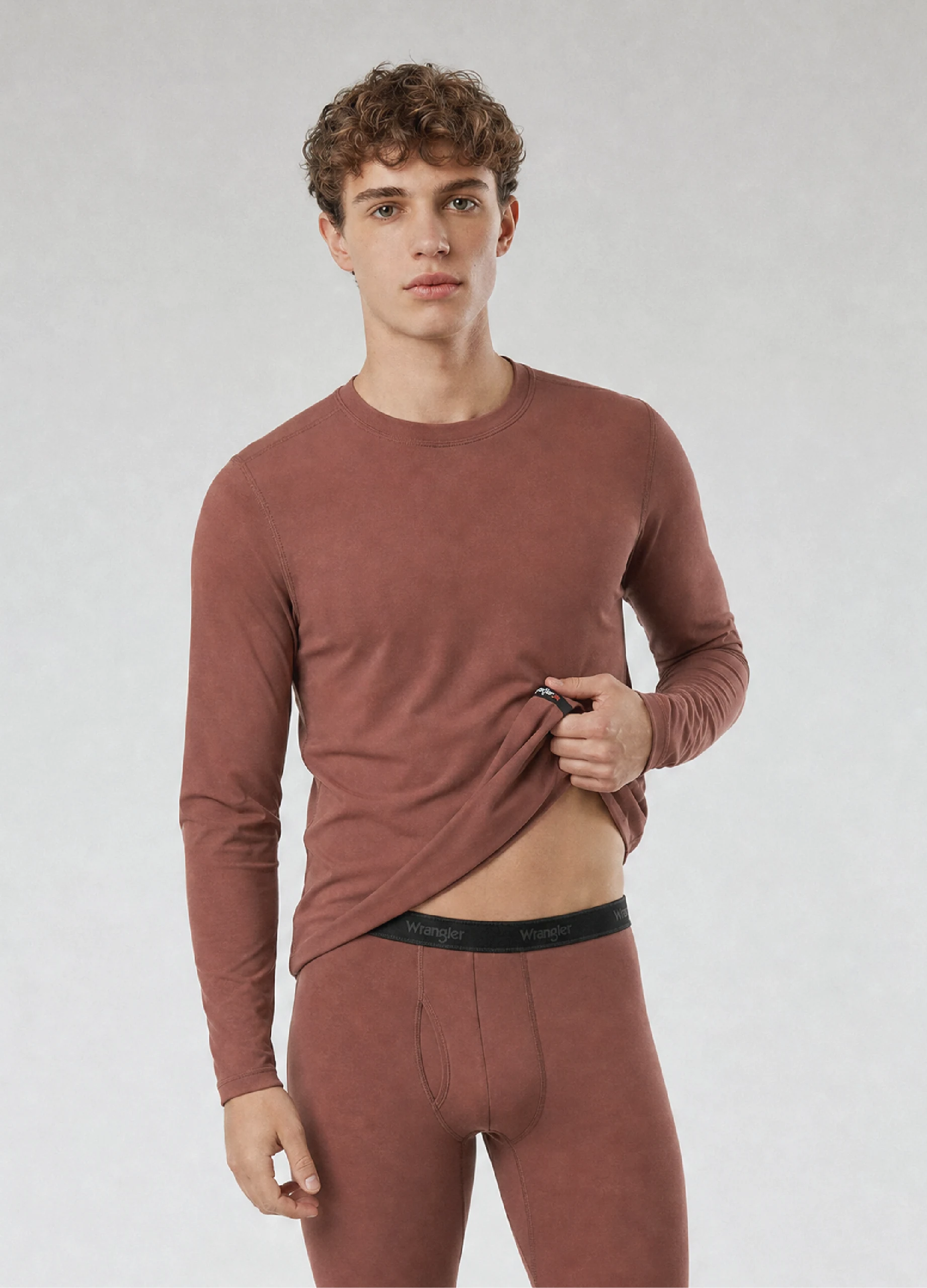 Model wearing a GMC Soft Touch base layer top and bottom