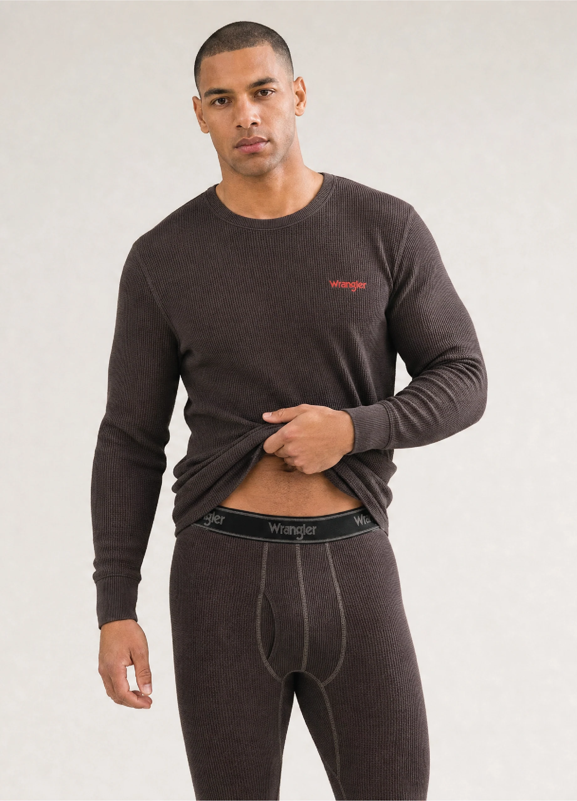Model wearing a GMC waffle thermal base layer top and bottom