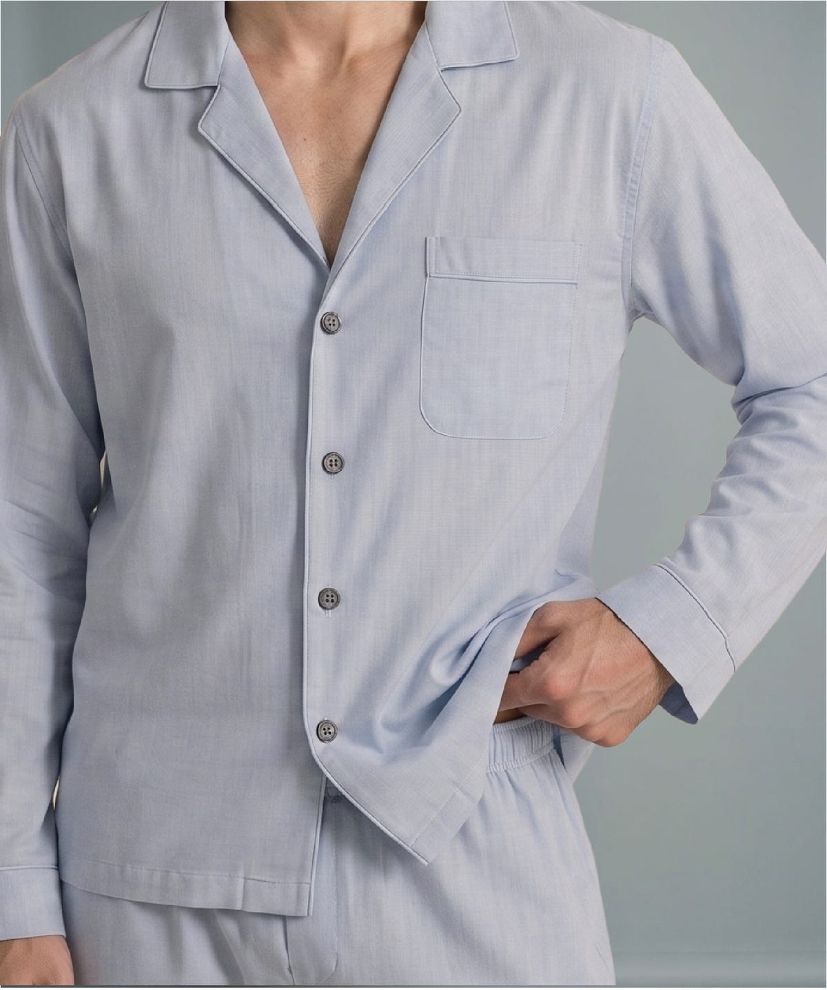 Man in a light blue woven pyjama set