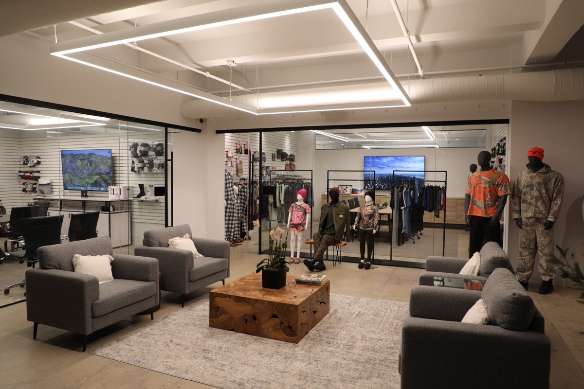 GMC New York showroom lounge, with seating and branded apparel displays